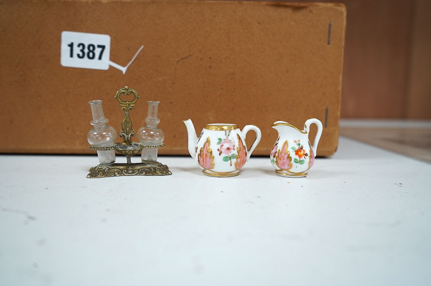 A children’s Beatrix Potter part tea set and other miniature porcelain tableware, largest 15.5cm wide. Condition - fair